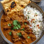 Fiery Beef Coconut Curry with Rice, Garlic Naan & Chili Garnish